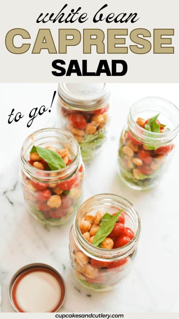 Text: White Bean Caprese salad to go with jars holding the salad on a table.