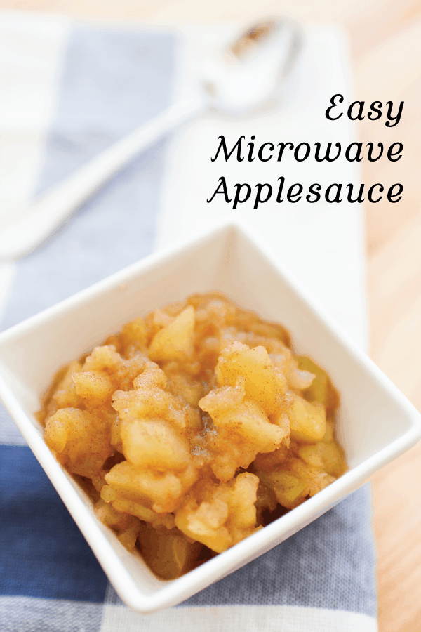 Close up of a small square dish holding apple sauce. 