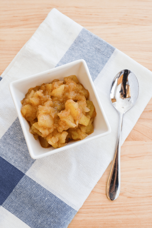 Overhead view of a small bowl with applesauce. 