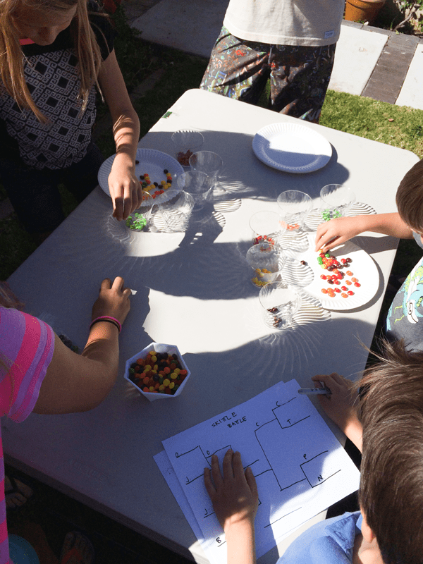 Timed skittles game is easy, cheap and a great activity to play at kid's parties!  // www.cupcakesandcutlery.com