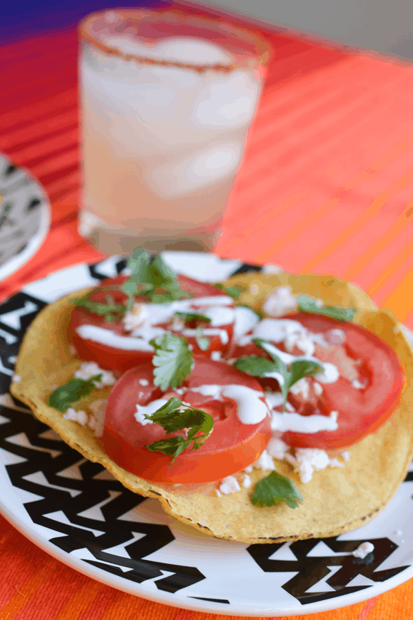 Close up of a caprese tostada recipe on a plate. 