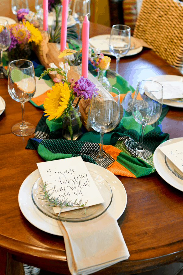 Dinner table set with flowers and candles. 