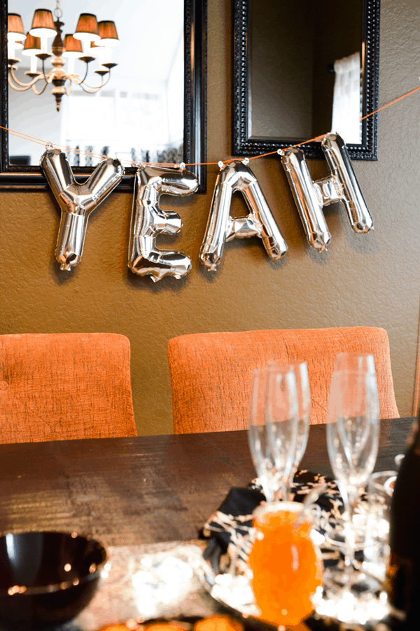 Silver balloons that spell out "yeah" for holiday decorating