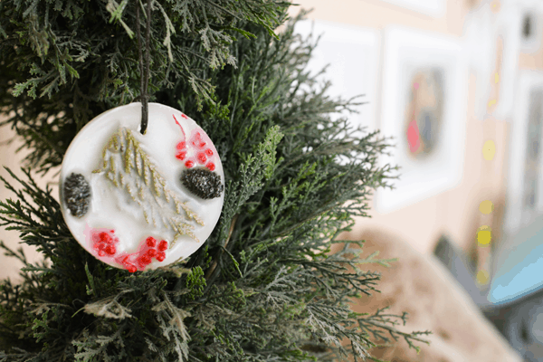 Pine scented ornament hanging on a Christmas tree.