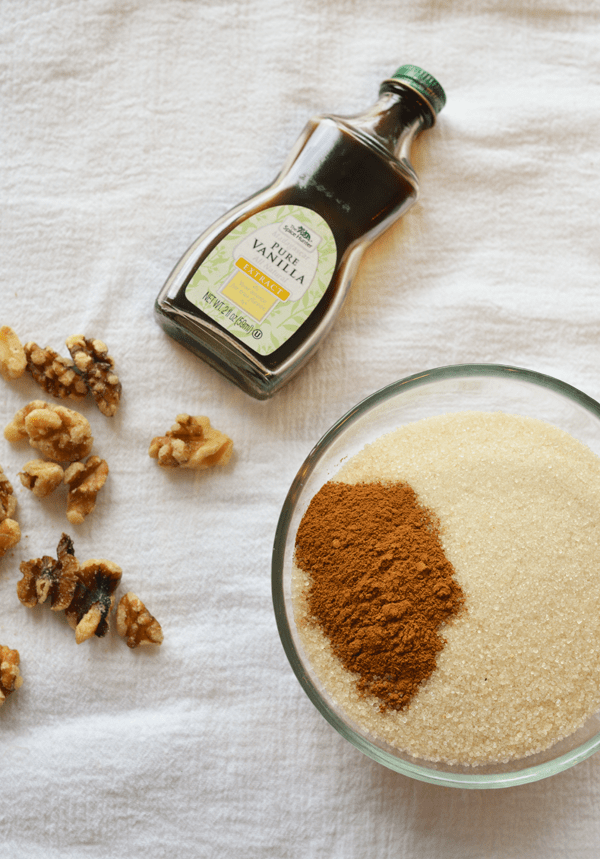 Ingredients to make my Cinnamon Walnuts Recipe on a white cloth.