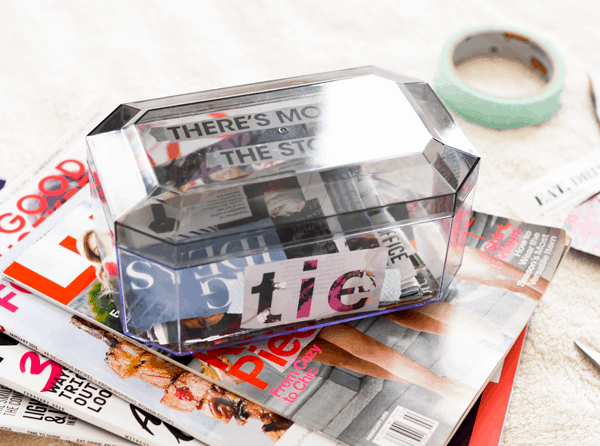 A box with cut out words from magazines to make a vision box.