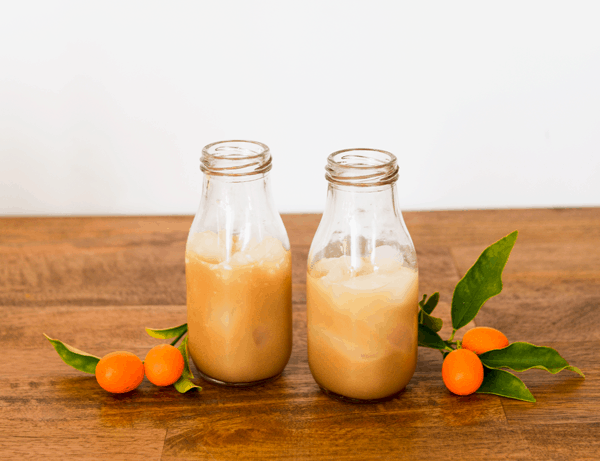 Coconut Rum White Russian on a wooden board.