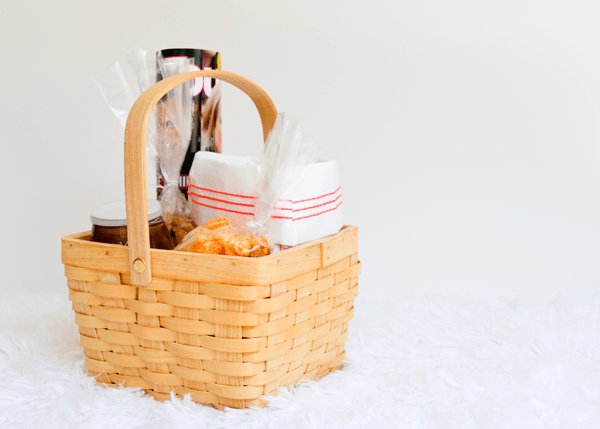 A bad day gift care package in a basket on the table. 