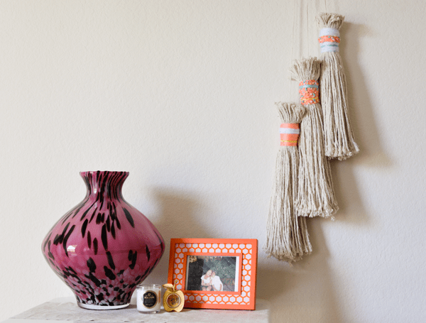 Update your home decor with these over sized DIY tassels! You'll never guess what they're made from! 