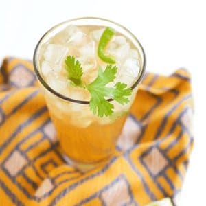 Close up of a Tequila Mule with Jalapeno on a napkin.