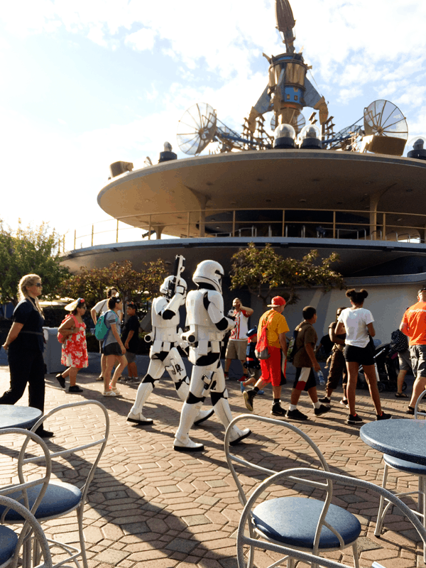 Make sure to plan for breaks during your day at Disneyland. People watching is super fun but you can also watch a show! 