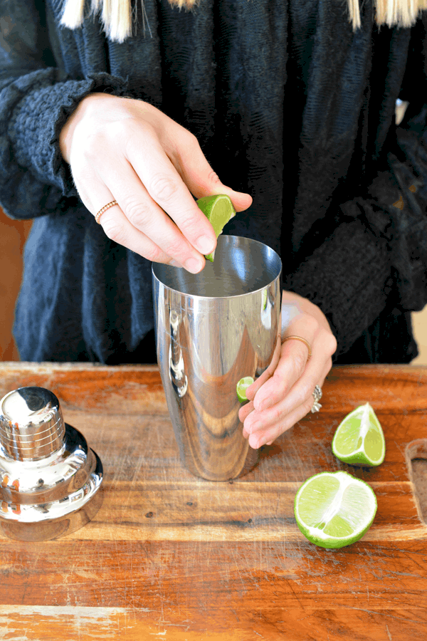 Peach Paloma cocktail recipe with fresh lime juice in a cocktail shaker. 