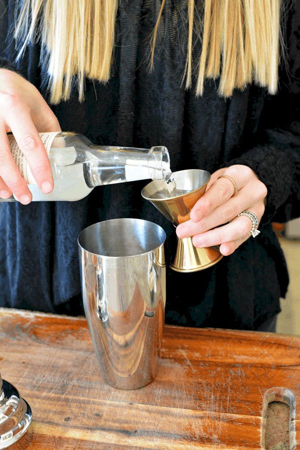 Making a peach grapefruit cocktail.