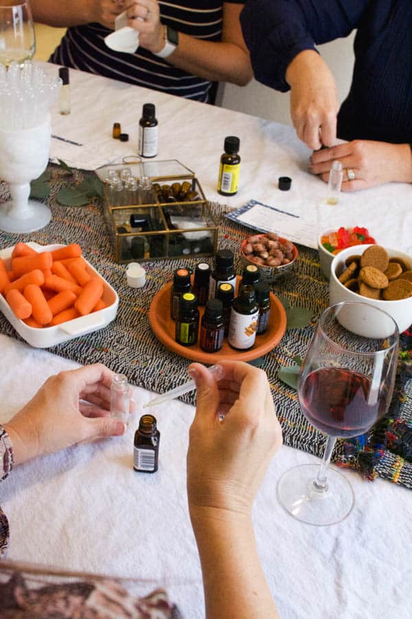 Women around a table blending holiday essential oil blends.