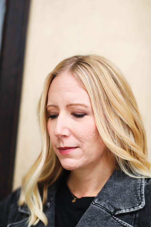 Close up of a woman's face with acne scars.