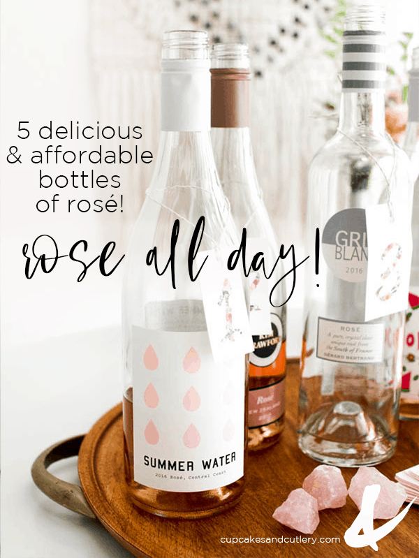 Bottle of rose on a wooden tray with text overlay.