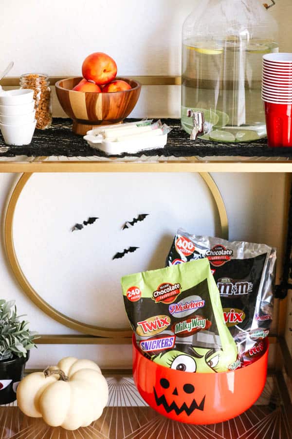 A bar cart set up for a kid's Halloween playdate. 