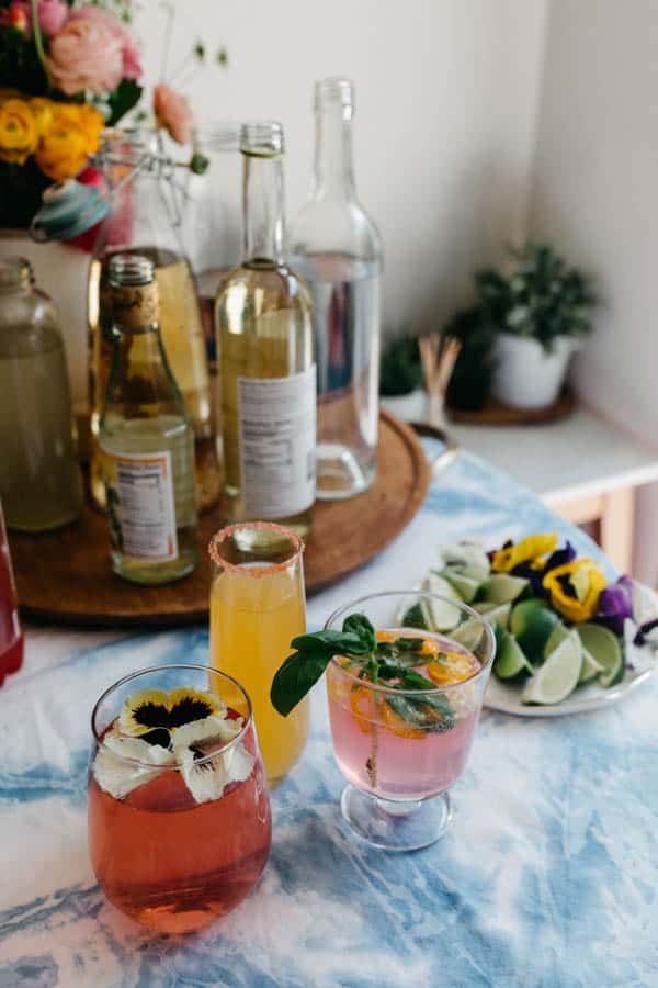 3 different non-alcoholic mimosas on a party table for Mother's Day.