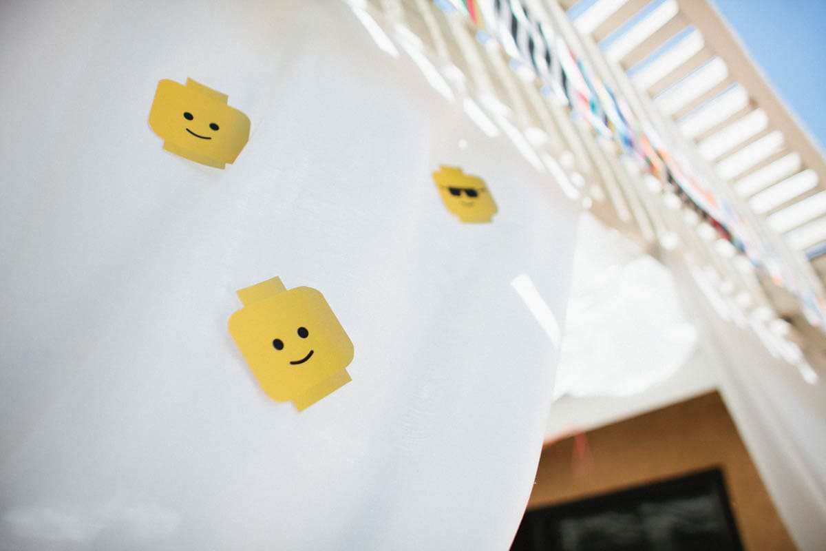 Lego head print outs used as decoration at a kids lego themed birthday party.