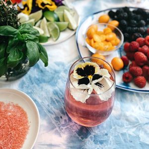 Pretty non-alcoholic mimosa topped with an edible flower.