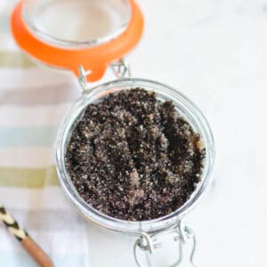 Close up of a jar holding a DIY coffee scrub.