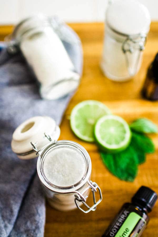 A small glass jar of bath salts scented with lime and peppermint to smell like a mojito.