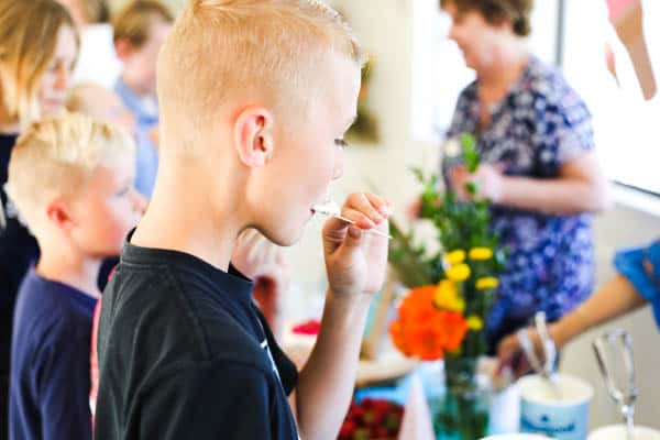 kid sampling ice cream flavors