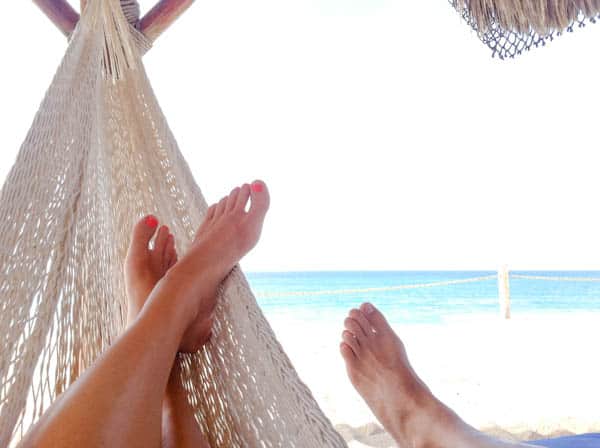 Sitting in hammocks at Dreams Los Cabos Suites Golf Resort & Spa in Mexico