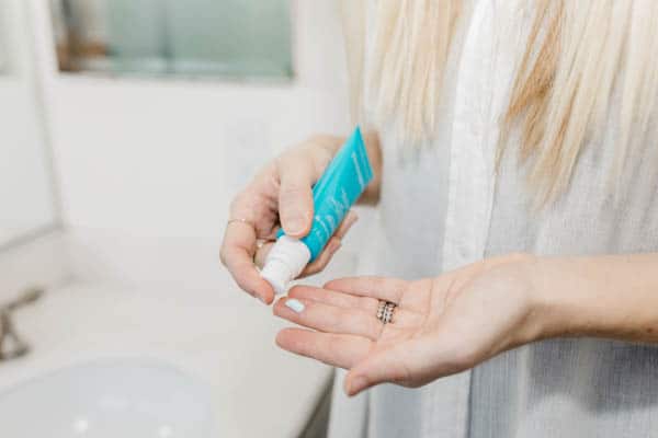 Neutrogena Hydro Boost Water Gel SPF being put on a woman's fingers.