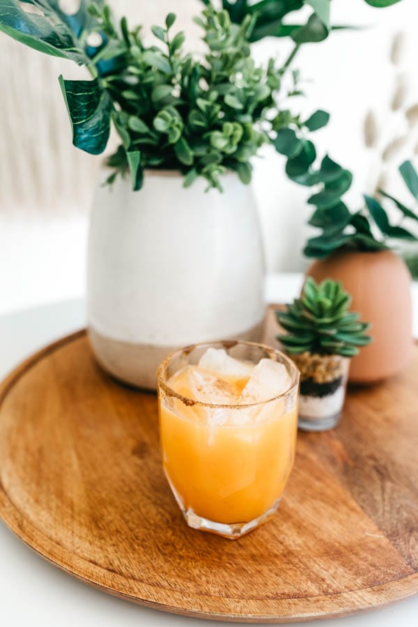 Pumpkin Margarita in a short glass on a tray.