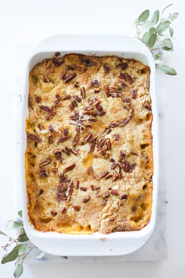 Easy sweet potato dump cake in a pan on a table.