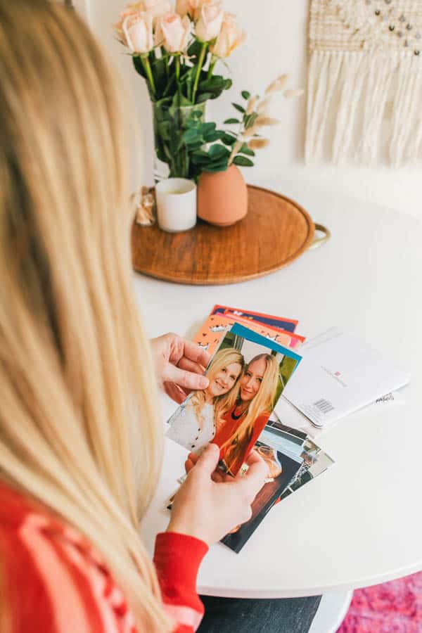 Woman looking at photos of best friend.