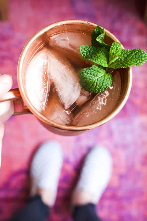 Close up of a Hibiscus Mule in a copper Mule mug and mint garnish.