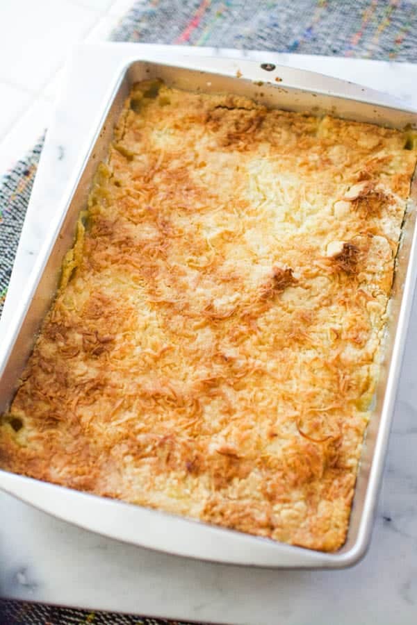 A baking dish on a counter with pineapple mandarin orange dump cake.