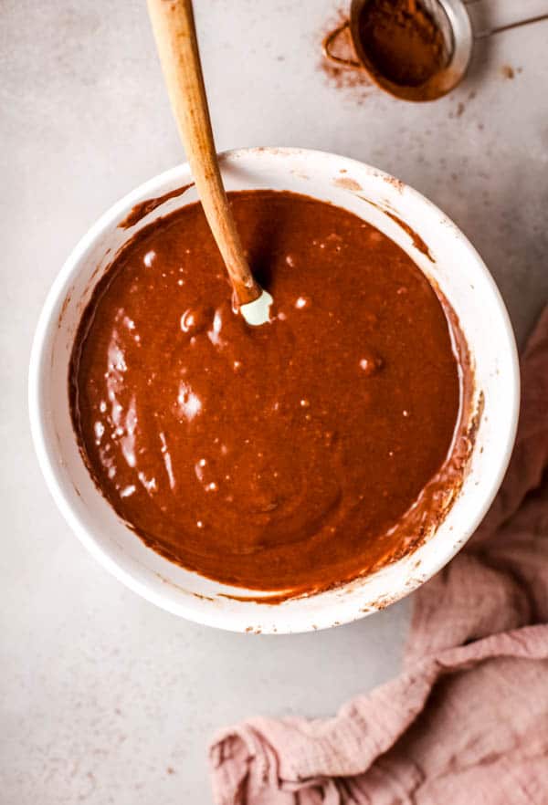 Overhead view of chocolate cupcakes batter.