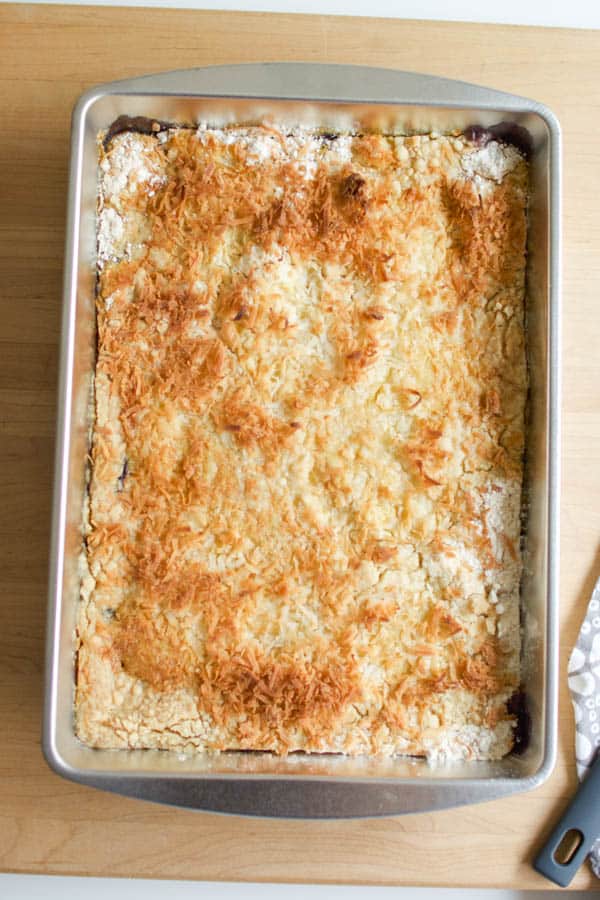 Baking dish with Blueberry Dump Cake topped with coconut.