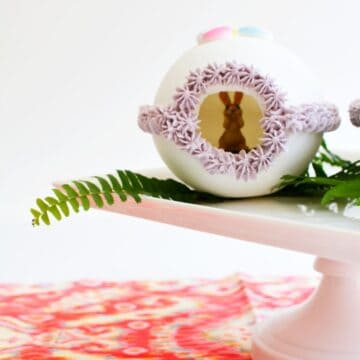 Close up of a panoramic sugar easter egg on a pedastal.