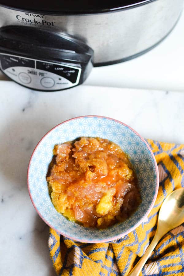 A portion of apple dump cake made in a slow cooker