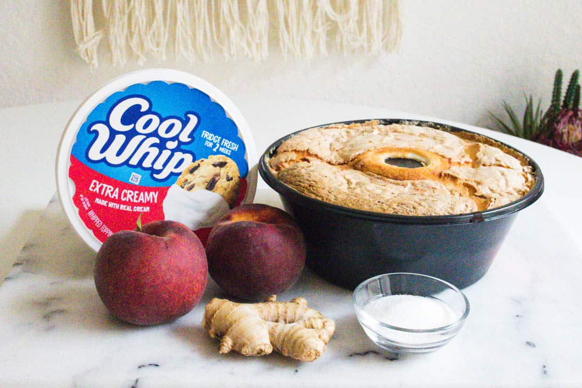 Ingredients to make an angel food cake dessert with ginger and peaches.