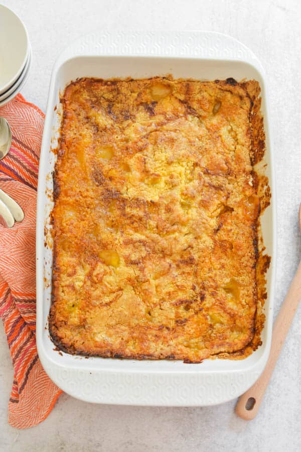 Peach dump cake in baking dish.