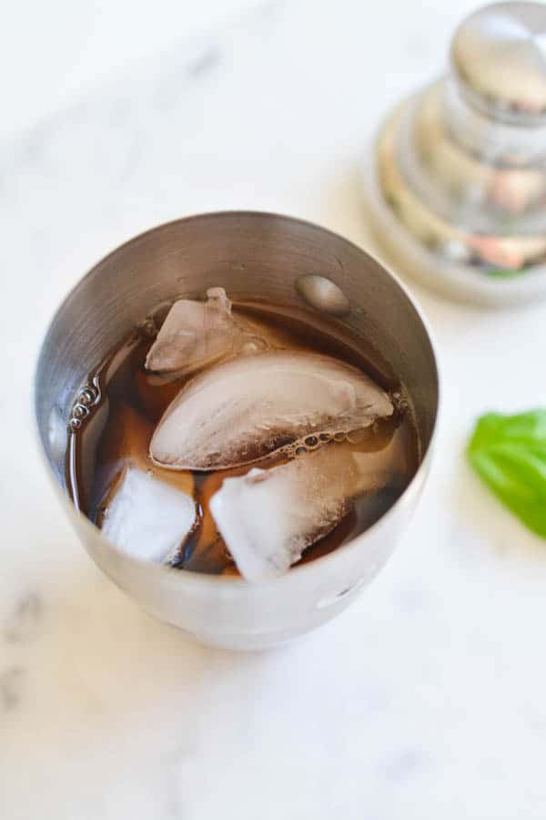 Ice and iced tea in a cocktail shaker.