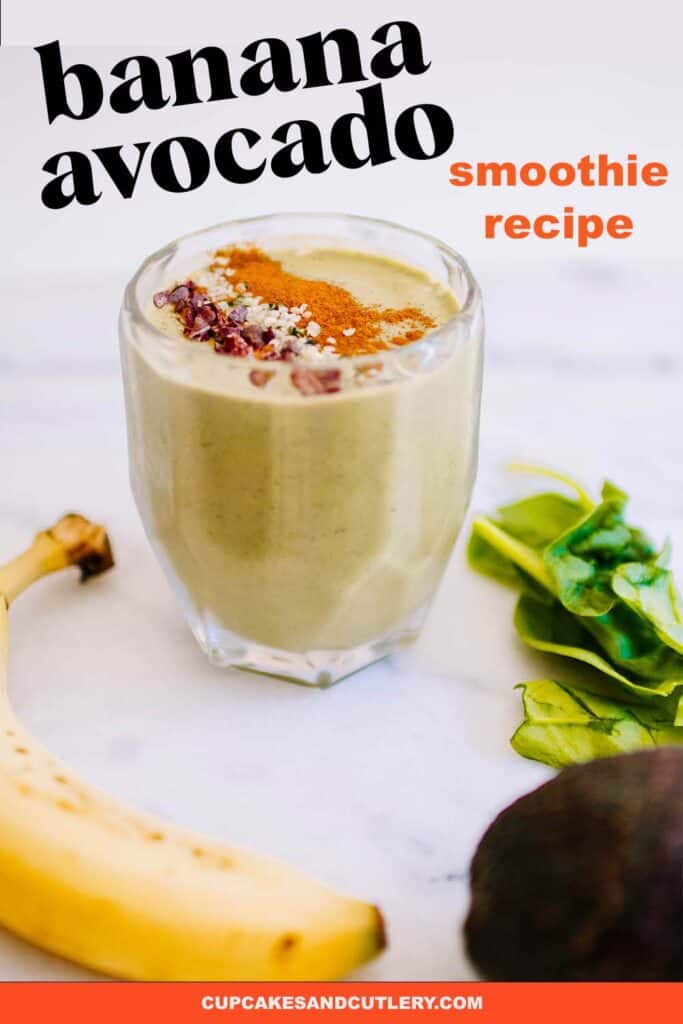 A smoothie made from avocado and banana on a table with a banana and avocado next to it on the counter.