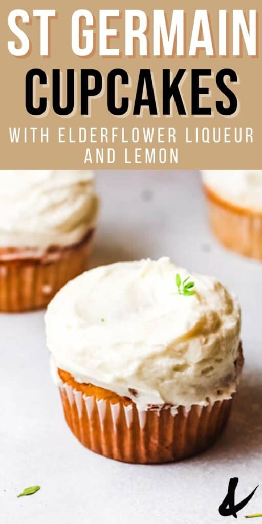 Close up of a lemon buttercream frosted elderflower cupcake on a table.