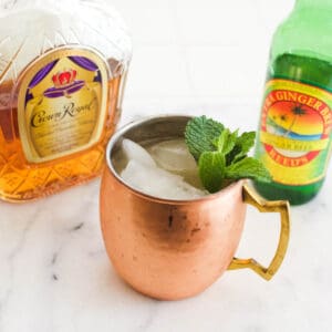 Copper mug holding a Moscow Mule with whiskey.