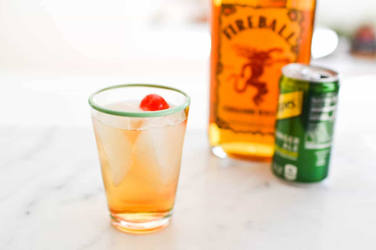 Close up of a glass with ginger ale and Fireball Whiskey.