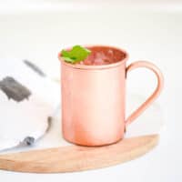 Close up of a copper mug on a table.