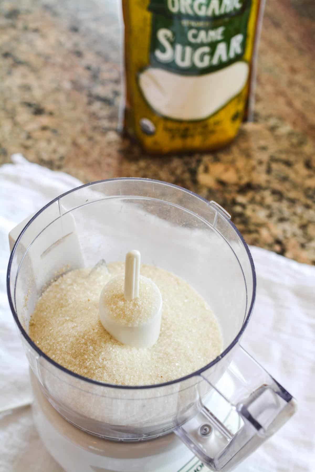 Sugar in a food processor bowl.