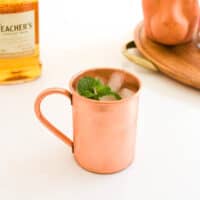 Close up of a copper mug on a table.