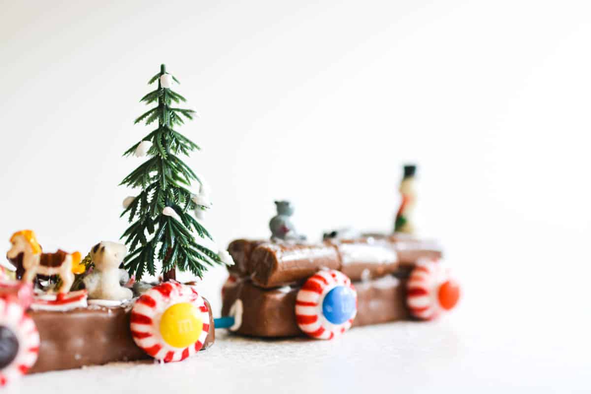 Close up of holiday miniatures on a candy bar train.