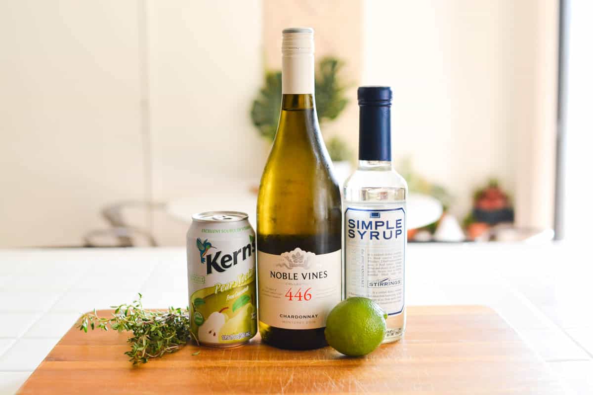 Ingredients for a Pear cocktail made with chardonnay.